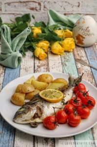 dorado, sea bream, baked, potatoes, tomatoes, herbs, spiced, tasty, easy, recipe, easter, classic, dish, meal, menu, roses, yellow, napkin, rabbit, fold