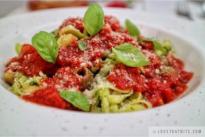 zucchini, noodles, garlic, tomato, sauce, zoodles, low-carb, vegan, recipe, delicious, easy, quick, dinner, light, lunch, menu, tasty, delicious, guilt-free, basil, parmesan, cheese, olives, chili